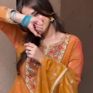 The top is a straight-cut or lightly flared kurta with full, long sleeves.